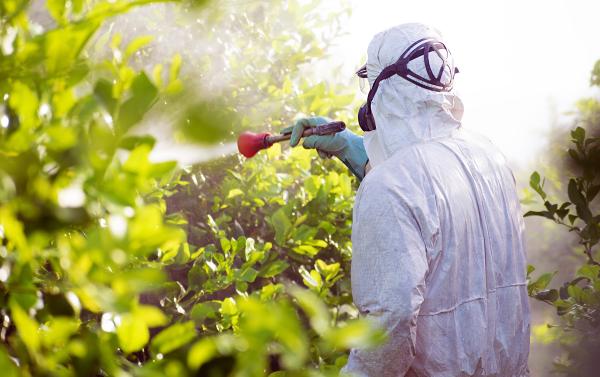 Person spraying generic biopesticide.